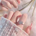 Classic heart-shaped ring with center zircon stone and pave diamonds on silver band - J389 (White Gold)
