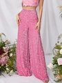Women's pink sequin high-waist wide-leg pants for parties with floral studio background - S / Pink