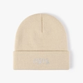 Beige knit beanie for winter with white embroidered mimi cursive text on the cuff - Beige