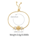 Detail of adjustable gold bracelet with star and heart charms showing size 23cm measurements - Fan-Shaped/Clover Style