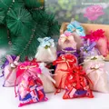Colorful organza drawstring gift bags with ribbon bows and floral accents for candy packing - Random Mix