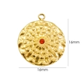 Close-up of a 16mm hammered 14K gold plated flower pendant with a central red gemstone - Red Zirconia