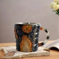Artistic mineral crystal coffee mug with blue bark texture and amber resin accents - Dark Blue Amber