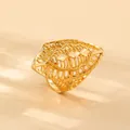 Dubai style gold hollow spindle ring with intricate filigree and vintage faceted design - Spindle Faceted Hollow Style