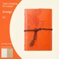 Orange A7 faux leather leaf journal with vintage metal pendant and elastic closure - Lined / Orange / A7