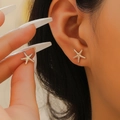 Gold starfish clip-on earring for women, coastal style jewelry with metallic finish - Gold (X489)