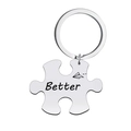 Detailed macro view of a puzzle-shaped stainless steel keychain with Better engraving - Better Keychain / Silver
