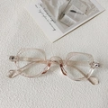 Detail of transparent pink geometric eyeglasses frame with resin texture on white surface - Transparent Champagne