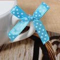 Blue satin bow with white polka dots tied to a ceramic mug handle for gift decoration - Sky Blue