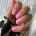Glossy pink solid color short press-on nails shown on hand with a smooth finish - Pink (JP2182)