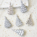 Close-up of glitter and mirror silver Christmas tree ornaments on white festive fabric - Silver Christmas Tree 6-Piece Set