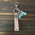 Western boho leather keychain with sunflower charm, turquoise pendant and blue tassel - Off-White Embossed Flower
