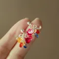 Starry butterfly stud earrings with colorful resin beads and silver-tone metal finish - Colorful Multi-Color Beaded Decorative Stud Style (7970)