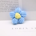 Handcrafted blue and yellow crochet flower accessory for DIY crafts and hair ornaments - Blue