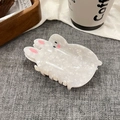 Detailed view of a white rabbit-shaped hair claw clip with pearlescent resin finish - Cream White (10cm)