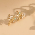 Golden flower bouquet stud earrings with white pearls and a soft green gemstone - Flower Bouquet Pearl Studs