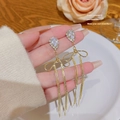Golden tassel earrings with bowknot and teardrop crystal shown in elegant lifestyle setting - E0322 Gold Silver Needle (Drop Bow Fine Tassel Gold)
