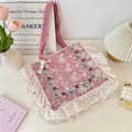 Close-up of floral embroidery and white lace trim on pink plaid canvas tote bag - Red Checkerboard
