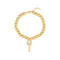 Detailed macro view of golden beaded bracelet featuring a sparkling rhinestone key pendant - Key Style (B2373-GO)
