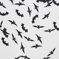 Halloween party confetti set featuring black bat and bird paper cutout decorations - Black Bat