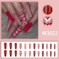Detail view of long coffin press-on nails in red and pink ombre heart gradient style - W3022 Red Pink Heart Style