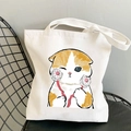 White canvas tote bag featuring a cute orange and white cartoon cat print - Ginger White Cat with Flower Ball