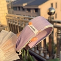 Pale purple fabric headband with orange button detail and white Alline brand label - Purple Plaid Trim Wide Headband with Orange Button
