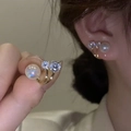 Detail of golden metal stud earring featuring a large pearl and sparkling zircons - 45# Silver Needle-Gold-Pearl