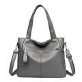 Detailed view of the gray PU leather shoulder bag with embossed logo and metal zipper - Gray