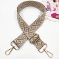 Detail of adjustable geometric ethnic embroidery bag strap with gold-tone metal hooks - Gold Buckle / Lotus root pink