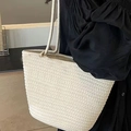 Handmade cream woven tote bag with thick handles shown on a model in a black dress - Plain Beige No Accessories