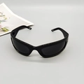 Top view of black wrap-around sports sunglasses with dark grey one-piece lens on grey base - Bright Black