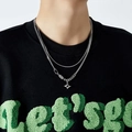 Detailed close-up of a silver double-layer necklace with a stylish cross pendant on a model - 20# Necklace—Star Double Layer