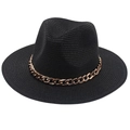 Detail of black straw Panama hat with a chunky rose gold chain and woven texture - One Size / Black