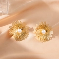 Elegant gold hollow flower stud earrings with central pearl on champagne satin - Flower 1