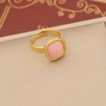 Detail of square pink cat eye stone ring with adjustable gold open band - Ring