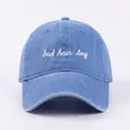 Detail of white bad hair day cursive embroidery on washed blue denim baseball cap - Adjustable / Blue (Bad Hair Day)
