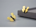 Macro shot of S925 silver ginkgo butterfly earrings with matte gold and black finish - 925 Silver / Black-Gold Two-Tone