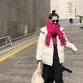 Magenta chunky knit mohair scarf with tassels paired with a white winter parka jacket - Rose Red