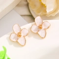 Macro detail of four-petal flower earrings with soft pink enamel and gold-plated edges - 01 White KC Gold