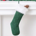 Dark green knitted Christmas stocking with white faux fur trim hanging on fireplace - 46cm / Green