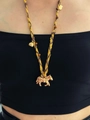 Braided rope necklace with golden zebra pendant and heart charms on a model - 5# Necklace Yellow Gold Zebra Shape