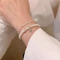 Double-layered pearl and silver chain bracelet featuring rectangular letter charm - Ultra-Fine Silver Nuggets Bracelet