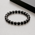 Detailed macro view of matte black agate beads with silver metal spacers on men's bracelet - Matte Black Agate (KB183242-TLX)