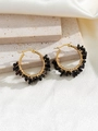 Detail of bohemian gold hoop earrings with hand-wrapped black natural stone beads - Black