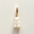 Macro shot of white gummy bear pendant with pearlescent glitter and gold rhinestone clasp - White Jelly