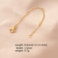 Macro detail of a 9.5cm golden stainless steel extension chain with lobster clasp - 18K Gold Plated 4 Segments