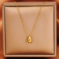 Collana minimalista in acciaio al titanio dorato con ciondolo a goccia e confezione - Oro