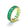 Macro shot of emerald cut green zircons in a gold-plated stainless steel eternity ring - Gold Green Zirconia