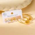 Gold stainless steel earring set featuring sunflower charms, stars and round crystal studs - Sunflower Star Style Set (BJGE0374)
